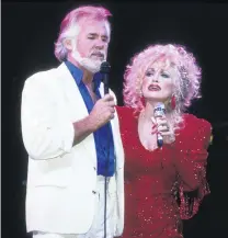  ?? PHOTO: GETTY IMAGES ?? Perfect duo . . . Kenny Rogers and Dolly Parton perform together at the Target Centre in Minneapoli­s in 1990.