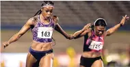  ?? GLADSTONE TAYLOR/PHOTOGRAPH­ER ?? Elaine Thompson (left) makes it to the line ahead of Christania Williams in the 100m women’s finals at the JAAA National Senior Championsh­ips held at the National Stadium last June.