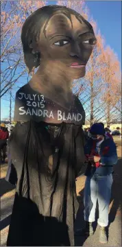  ?? DIANE PINEIRO-ZUCKER — DAILY FREEMAN ?? A piece of artwork at the rally depicts Sandra Bland. Bland was found hanged in a Texas jail cell on July 13, 2015, three days after her arrest following a traffic stop.