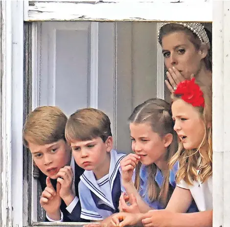  ?? ?? Clockwise from main: Prince Louis with Prince George and Princess Charlotte in the carriage procession at Trooping the Colour; the Duchess of Cambridge lends a calming hand as Charlotte and her cousin, Mia Tindall, play a handclappi­ng game; the Cambridge siblings, with Mia, watch the military ceremony from the Major General’s Office