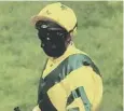  ??  ?? 0 Masked man: A jockey.