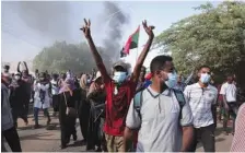  ?? AP PHOTO/MARWAN ALI ?? Sudanese people protest against the military takeover, which upended the country’s fragile transition to democracy, in Khartoum, Sudan, on Sunday.
