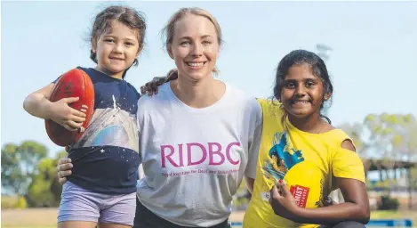  ?? Picture: KERI MEGELUS ?? Iyla Rear, 5, RIDBC teacher Liz Fisher and Irene Suraj, 9, at the sports camp at Marrara yesterday