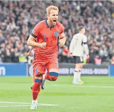  ?? — AFP photo ?? Kane celebrates scoring from the penalty.