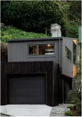  ??  ?? 1— The home is essentiall­y a single room positioned on top of a garage. 2— An interior cut-out creates a view shaft and harnesses light on the south-facing site.