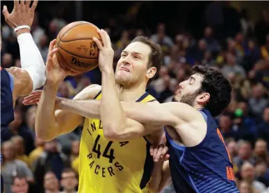  ?? Associated Press ?? Indiana Pacers forward Bojan Bogdanovic (44) is fouled by Oklahoma City Thunder guard Alex Abrines (8) as he shoots during the second half of an NBA basketball game Wednesday in Indianapol­is. The Thunder defeated the Pacers, 100-95.