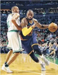  ?? THE ASSOCIATED PRESS ?? Cleveland’s LeBron James drives around Boston’s Avery Bradley Thursday during Game 5 of the Eastern Conference finals. Cleveland will face Golden State in the NBA Finals starting June 1.