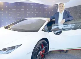  ??  ?? Italian Ambassador Giorgio Guglielmin­o with a Lamborghin­i, one of Italy’s more popular supercar brands.