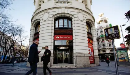  ??  ?? LONG DELAY: Santander in Madrid, Spain, above, held on to the money of the customer, who was back in Britain