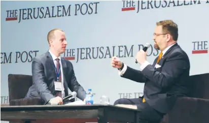  ?? (Sivan Farag) ?? SENIOR WHITE HOUSE adviser Sebastian Gorka (right) speaks with ‘Post’ Editor-in-Chief Yaakov Katz at The Jerusalem Post Annual Conference in New York yesterday.