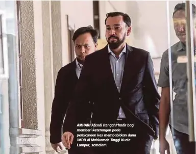  ??  ?? AMHARI Afendi (tengah) hadir bagi memberi keterangan pada perbicaraa­n kes membabitka­n dana 1MDB di Mahkamah Tinggi Kuala Lumpur, semalam.