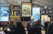  ?? DEMETRIUS FREEMAN / REUTERS ?? Guests tour the displays during the opening celebratio­n of the Statue of Liberty Museum on Liberty Island in New York on Wednesday.