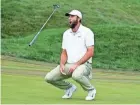  ?? MARTA LAVANDIER/AP ?? Scottie Scheffler flips his club after missing a birdie putt on the 18th green during the final round of The Players Championsh­ip on Sunday in Ponte Vedra Beach.