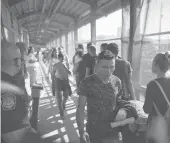  ?? EMILIO ESPEJEL/AP 2019 ?? Migrants return to Mexico as others line up to request asylum in the U.S. at the bridge in Matamoros, Mexico, that crosses into Brownsvill­e, Texas.