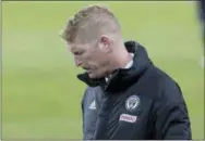  ?? CHRIS YOUNG — THE CANADIAN PRESS ?? Union coach Jim Curtin stares at the turf during the second half of his team’s 3-0 loss to Toronto FC Friday night. Curtin’s team has one win in its last 24 road chances.