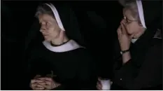  ??  ?? Nuns follow a solemn Easter vigil ceremony celebrated by Pope Francis, in St. Peter’s Basilica at the Vatican on Saturday. AP PHOTO/ANDREW MEDICHINI