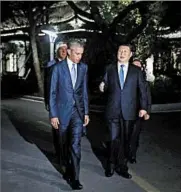  ?? CAROLYN KASTER/AP ?? President Barack Obama, and Chinese President Xi Jinping walk atWest Lake State Guest House in Hangzhou on Saturday. The ratificati­on of the Paris climate accords by the U.S. and China was announced amid the G-20 summit.