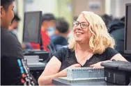  ?? ?? Arizona Teacher of the Year Nancy Parra-Quinlan teaching robotics at Kino Junior High School.