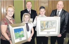  ??  ?? Picture perfect Sophie Quigg from Cathkin Primary and Ian Colburn from St Charles’, proudly display their framed paintings to officials, including Supercount­y’s John Scott, after taking part in the art-based County Galleries project organised jointly...