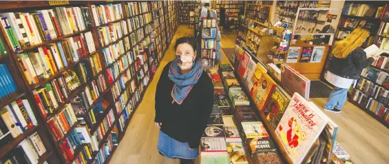  ?? ARLEN REDEKOP ?? “Right now in this pandemic and this time it is an opportunit­y for us to show how great Vancouver is as a book town,” says Hilary Atleo of Iron Dog Books on East Hastings.