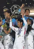  ??  ?? Kashima Antlers celebrate after beating Persepolis