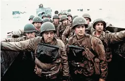  ?? DAVID JAMES/DREAMWORKS ?? Tom Sizemore, left, and Tom Hanks in the World War II saga “Saving Private Ryan” (1998), which won five Academy Awards, including best director (Steven Spielberg).