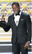  ?? CHRIS PIZZELLO/THE ASSOCIATED PRESS ?? Sterling K. Brown accepts the award for outstandin­g lead actor in a drama series for This Is Us.