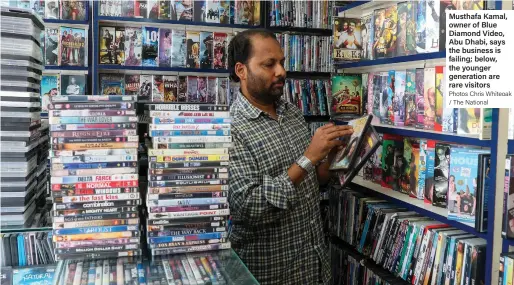  ?? Photos Chris Whiteoak / The National ?? Musthafa Kamal, owner of Blue Diamond Video, Abu Dhabi, says the business is failing; below, the younger generation are rare visitors