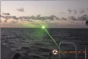  ?? PHILIPPINE COAST GUARD VIA AP ?? A green military-grade laser light from a Chinese coast guard ship in the disputed South China Sea on Feb. 6.
The Philippine­s on Monday 13, accused a Chinese coast guard ship of hitting a Philippine coast guard vessel with a military-grade laser and temporaril­y blinding some of its crew in the disputed South China Sea, calling it a “blatant” violation of Manila’s sovereign rights.