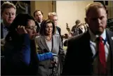  ?? ANNA MONEYMAKER — THE NEW YORK TIMES ?? House Speaker Nancy Pelosi, D-Calif., walks with reporters en route to the House floor at the Capitol in Washington on Friday.