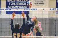  ?? ?? Darien’s Ellie Moore sends the ball back at Trumbull during a volleyball match in Darien on Oct. 9.