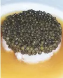  ??  ?? Appetizer for the gala dinner: Langoustin­e topped with caviar by Alain Ducasse.