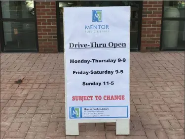  ?? ALEXIS OATMAN — THE NEWS-HERALD ?? Mentor Public Library has posted signs outside itsr branches amid virus