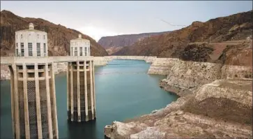  ?? John Locher Associated Press ?? NEARLY two decades of drought have taken their toll on Lake Mead, shown in 2014. The reservoir, Southern California’s source of Colorado River water, is 38% full as California, Arizona and Nevada plan for a shortage.