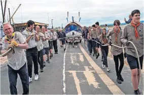  ?? ?? Team effort Scouts haul the 2.1 ton William Riley along Troon Beach