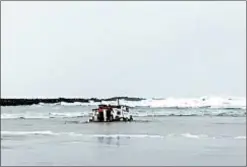  ?? OREGON STATE POLICE ?? Authoritie­s examine the wreckage of a crabbing ship that capsized Jan. 3 off the Oregon coast near Newport, killing three.