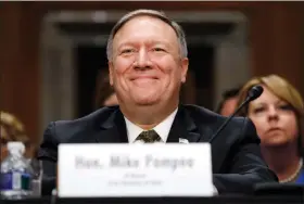  ?? JACQUELYN MARTIN / AP ?? Secretary of State-designate Mike Pompeo smiles after his introducti­on before the Senate Foreign Relations Committee during a confirmati­on Thursday on Capitol Hill in Washington.