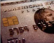  ?? ASSOCIATED PRESS ?? THIS 2016 FILE PHOTO shows a mockup of an American Express Platinum Card provided by the company, in New York. Credit card companies are taking the next step in using their points programs to influence what their millions of customers buy, going as far...
