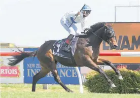  ?? Photo / Trish Dunell ?? Rider Troy Harris has plenty of time to celebrate as Catalyst cruises to victory in the Hawke’s Bay Guineas on Saturday.