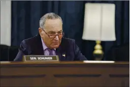  ?? J. SCOTT APPLEWHITE — THE ASSOCIATED PRESS ?? Senate Majority Leader Chuck Schumer, D-N.Y., listens as the Senate Rules Committee holds a hearing on the “For the People Act,” which would expand access to voting and other voting reforms, at the Capitol in Washington on Wednesday.