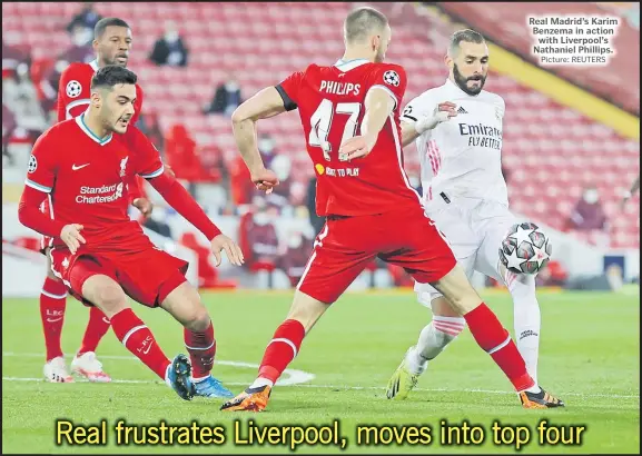  ?? Picture: REUTERS ?? Real Madrid’s Karim Benzema in action with Liverpool’s Nathaniel Phillips.