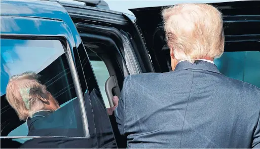  ?? ALEX EDELMAN AFP VIA GETTY IMAGES ?? Donald Trump steps into his limo in West Palm Beach, Fla., Wednesday. Four years of an “uncivil war” leave President Joe Biden an uphill fight in his goal of “unity.”