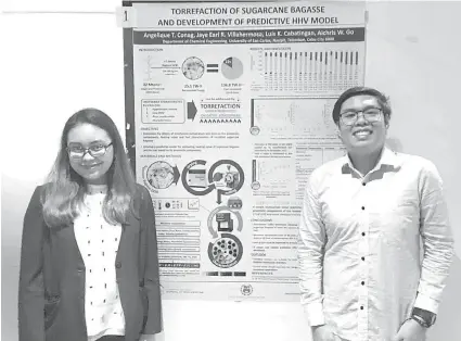  ?? / Tampo nga hulagway ?? ■ NAPILING 2ND PLACER. Mao ni sila si Angelique Conag ug Jaye Earl Villahermo­sa, mga tinun-ang 5th year sa BSChE sa University of San Carlos, nagbarog tungod sa ilang poster sa malampuson nilang research, ang “Torrefacti­on of Sugarcane Bagasse and...