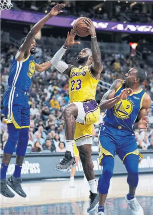  ?? JOHN LOCHER THE ASSOCIATED PRESS ?? After dominating the East, LeBron James headed west to join the Lakers, putting him on a collision course with Kevin Durant (left), Andre Iguodala and the powerhouse Warriors.