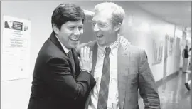  ?? Mark Boster ?? BILLIONAIR­E ACTIVIST Tom Steyer, right, with state Sen. Kevin de León in 2014, is backing a proposal by De León and another senator to cut fossil fuel use.