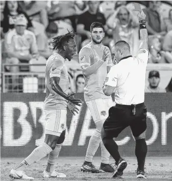  ?? Godofredo A. Vasquez / Staff photograph­er ?? The Dynamo were hit with three red cards Saturday against Sporting Kansas City, including one to Alejandro Fuenmayor, center, that left Alberth Elis incensed.