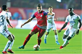 ??  ?? Jamshedpur FC striker Sergio Castel (centre) scored his fifth goal of the season against NorthEast United FC