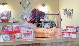  ??  ?? Candy, cake pops and Butcher Barbecue products are ready to fill Valentine's Day gift baskets at the Arcadia Farmers Market General Store. [PHOTO PROVIDED]