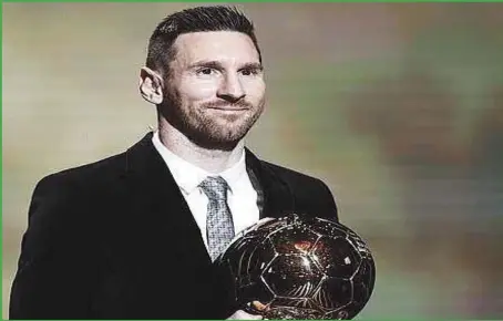  ??  ?? Lionel Messi with the sixth Ballon D’OR award last night in Paris