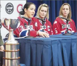  ?? CP PHOTO ?? Les Canadienne­s de Montreal players (from left) Caroline Ouellette, MariePhili­p Poulin and Lauriane Rougeau are shown with the Clarkson Cup at a news conference.